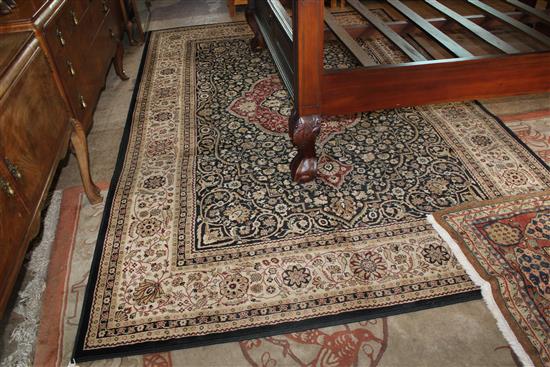 Persian design dark blue ground medallion carpet